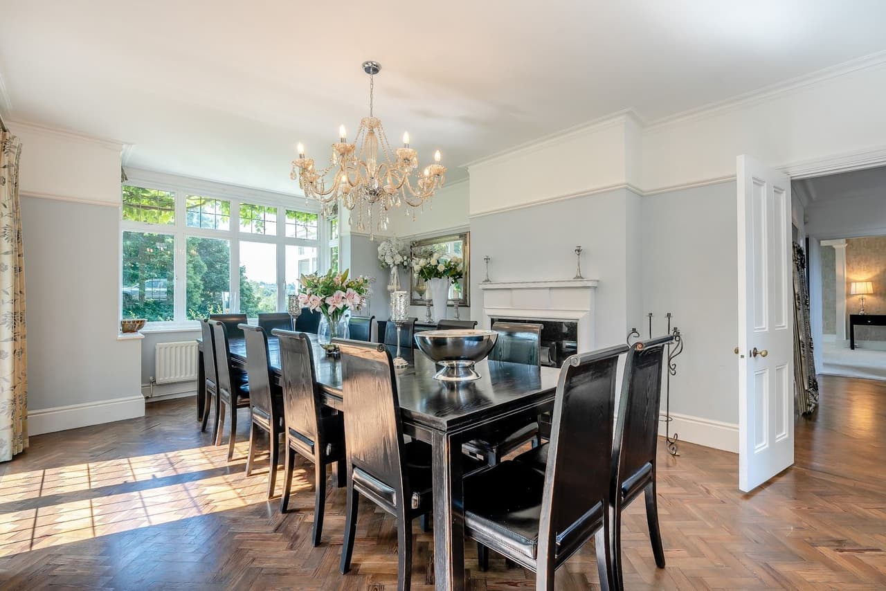 A formal dining room with a chandelier