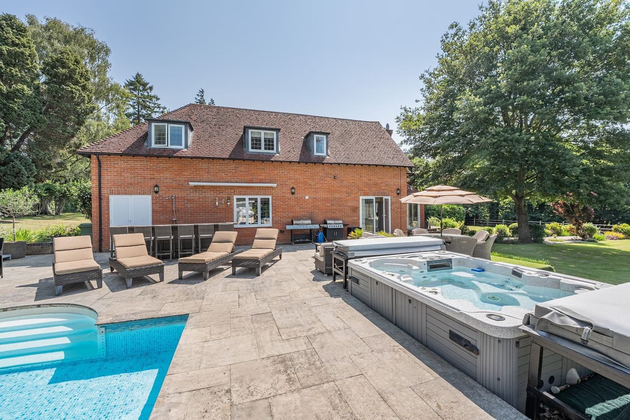 The hot tub and pool terrace at Old Lakenham