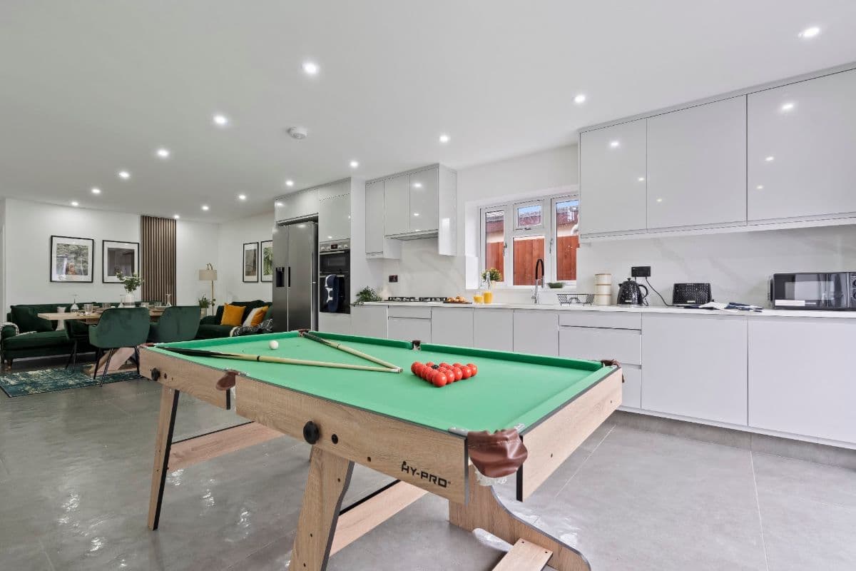 An open kitchen with a pool table